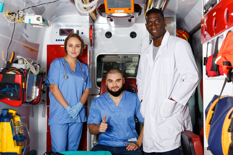 three medical personnel on duty shows confidence and are certified with renewed ACLS certification